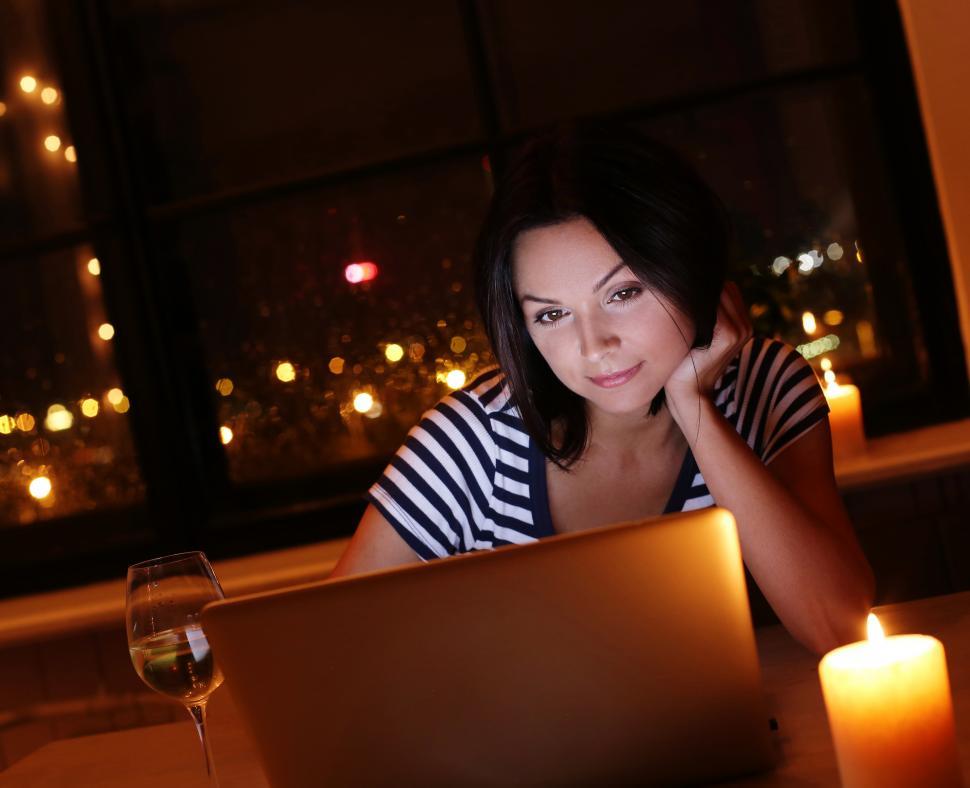 Free Image of Woman looking at computer screen 
