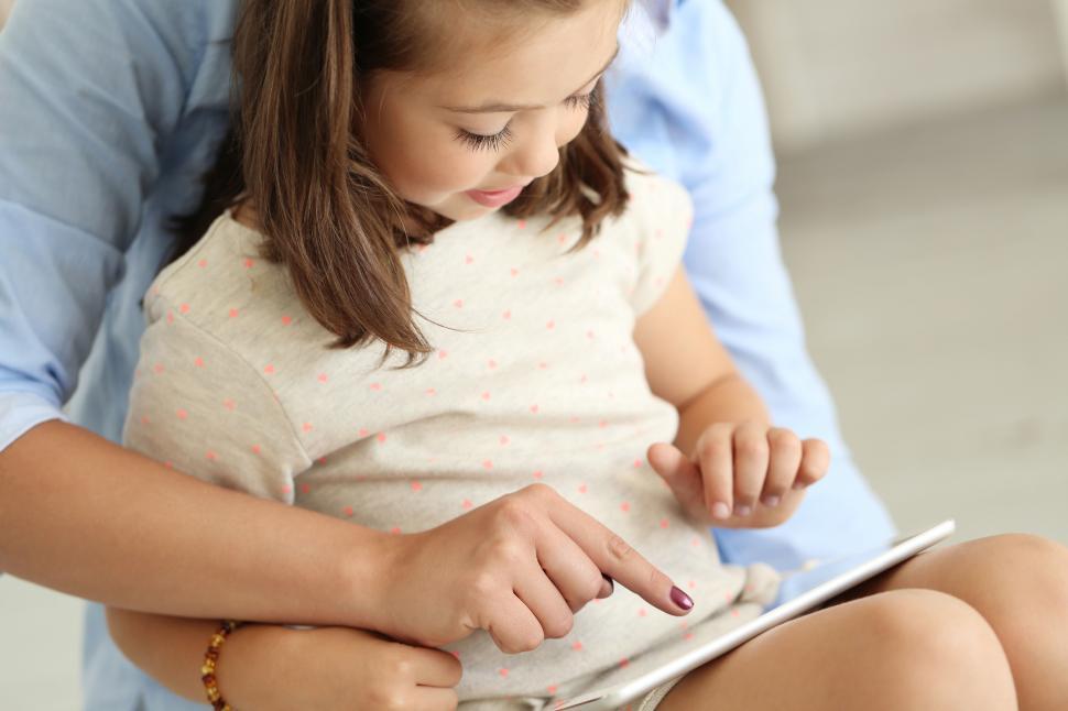 Free Image of Little girl using tablet computer 