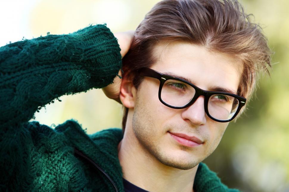 Free Image of Man in glasses and green sweater 