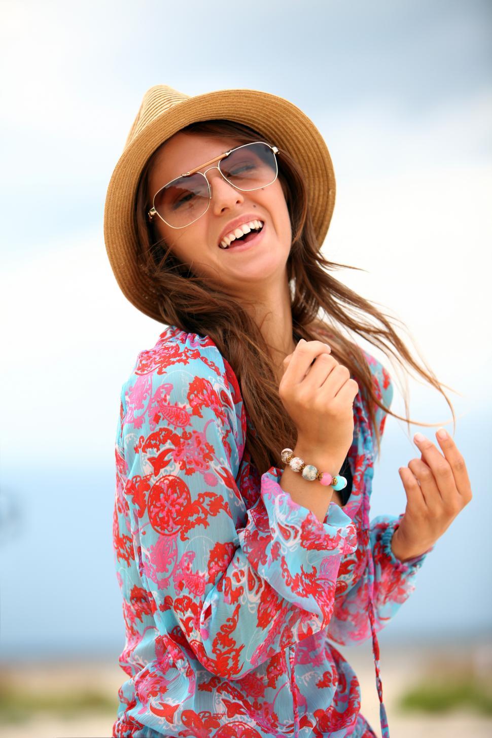 Free Image of Young and happy woman on the beach 