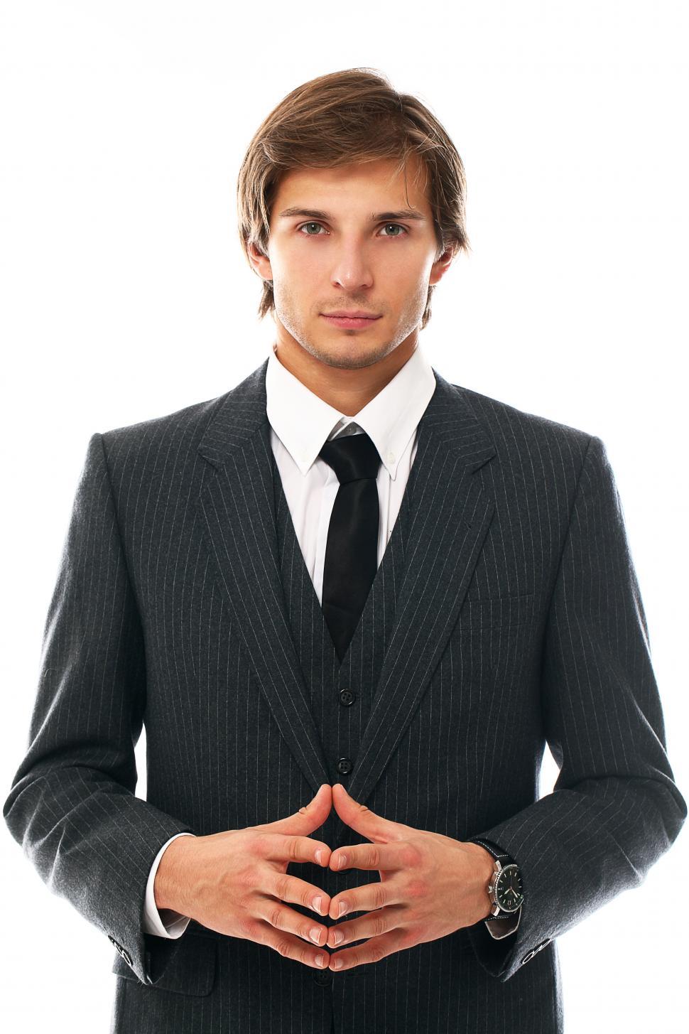 Free Image of Attractive businessman standing facing camera 