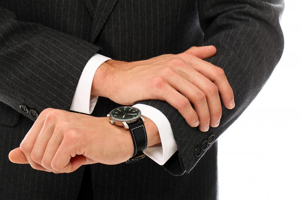 Free Image of Businessman looking at his watch 