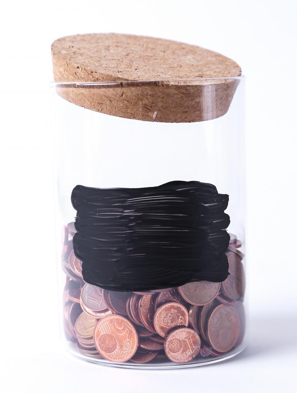 Free Image of Jar for coins with black label 