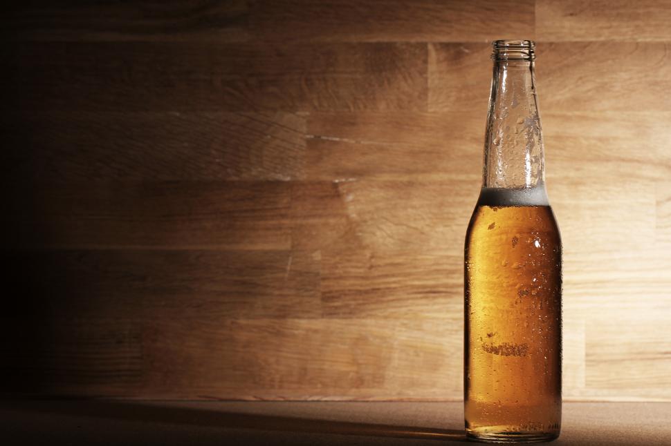 Free Image of One single beer over wooden surface 