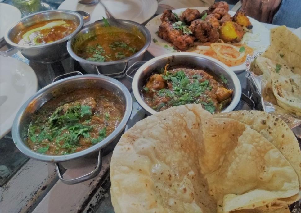 Free Image of Restaurant table of mixed Indian foods  