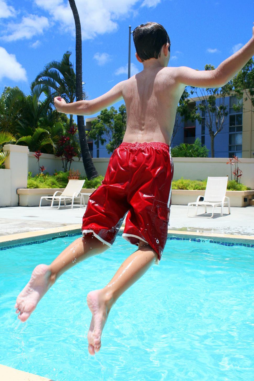 Download Free Stock Photo of Boy jumping into the pool 