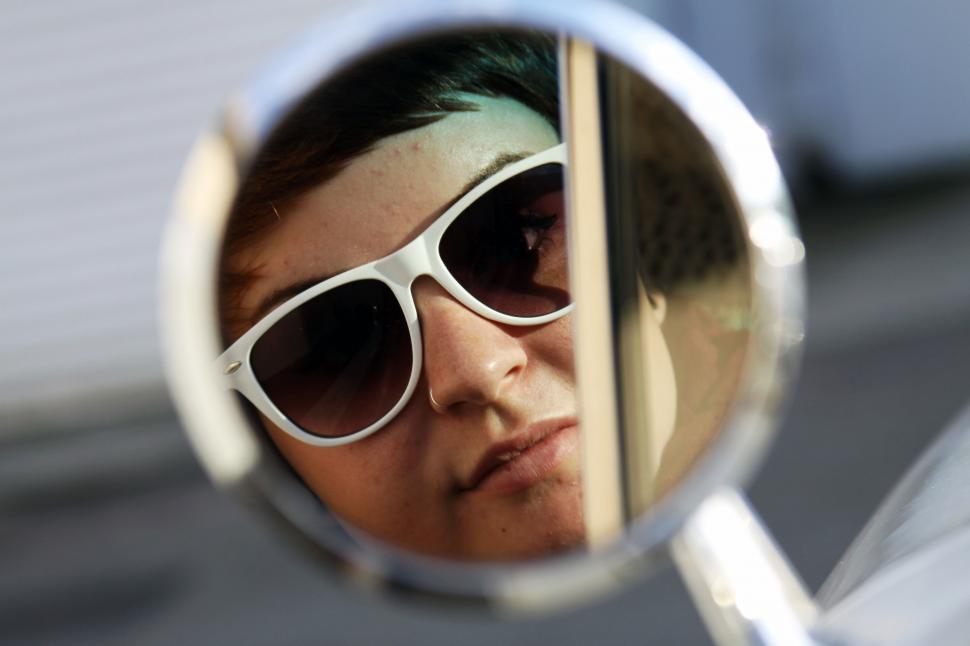 Free Image of Woman and car mirror 