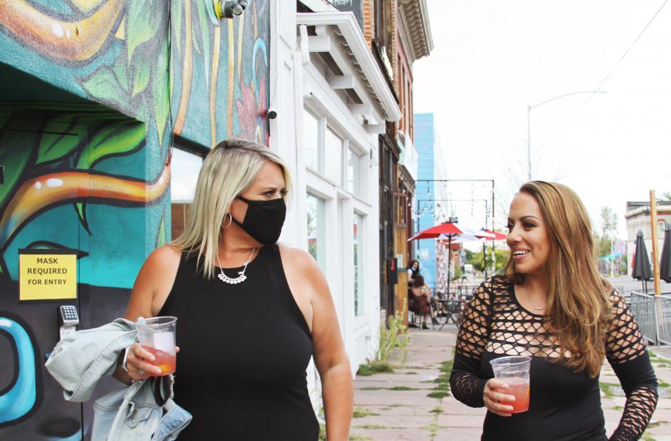 Free Image of Urban women walking with face masks on the street - COVID-19 out 
