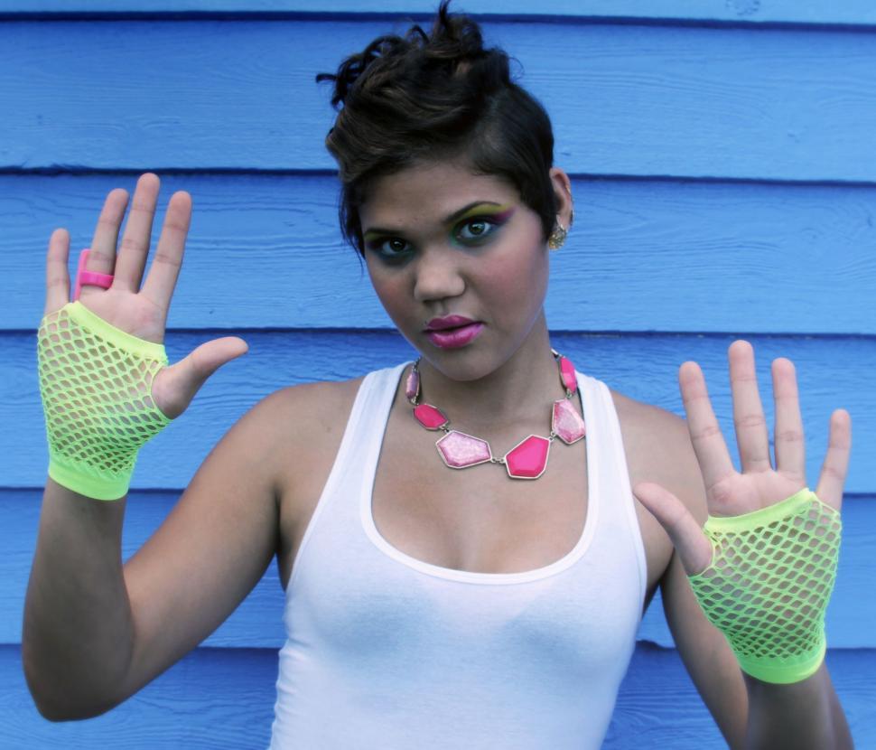 Free Image of Female fashion model with neon gloves and pink lips - looking at 