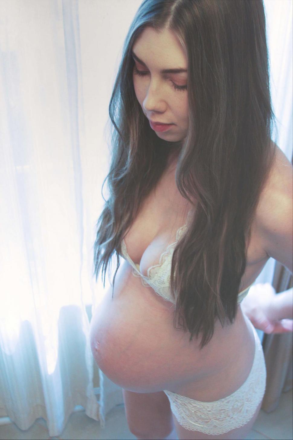Free Image of Pregnant woman with long black hair 