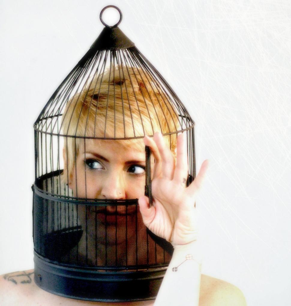 Free Image of Woman in birdcage 