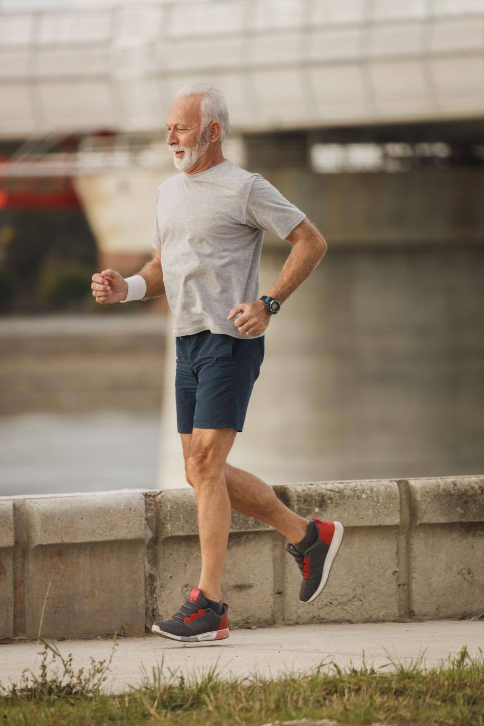 Download Free Stock Photo of Senior man running on the bridge 