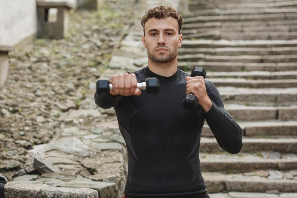 Free Image of Young man with dumbbells 