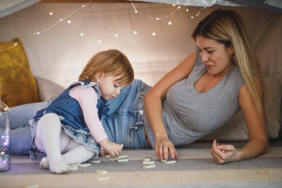 Free Image of Mother and child in a tent at home - Happy family 