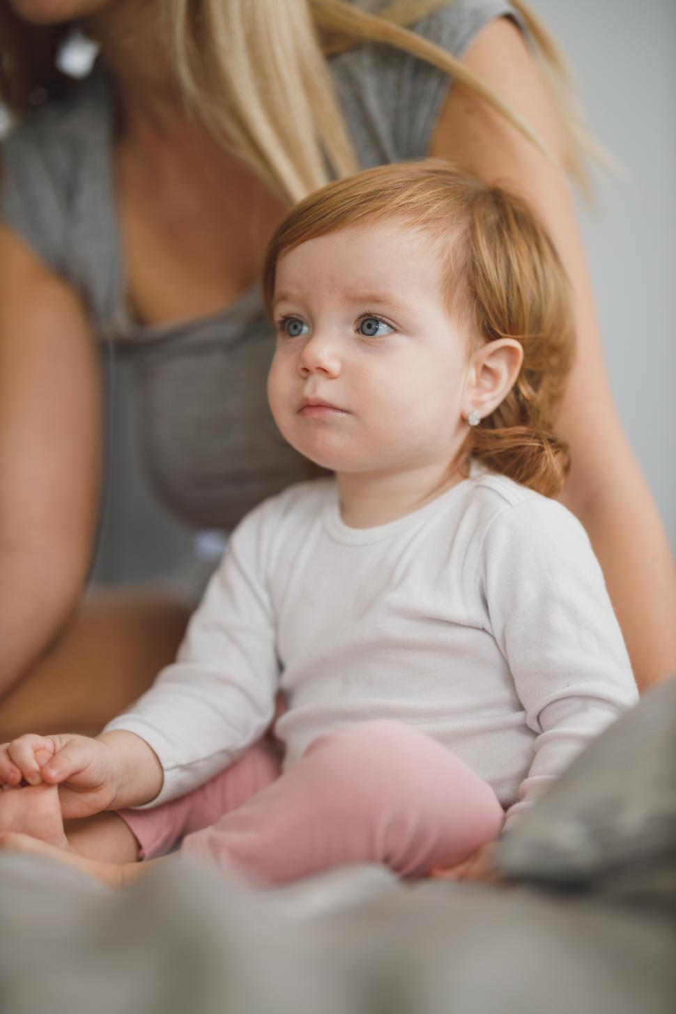 Free Image of Little baby girl with red hair 