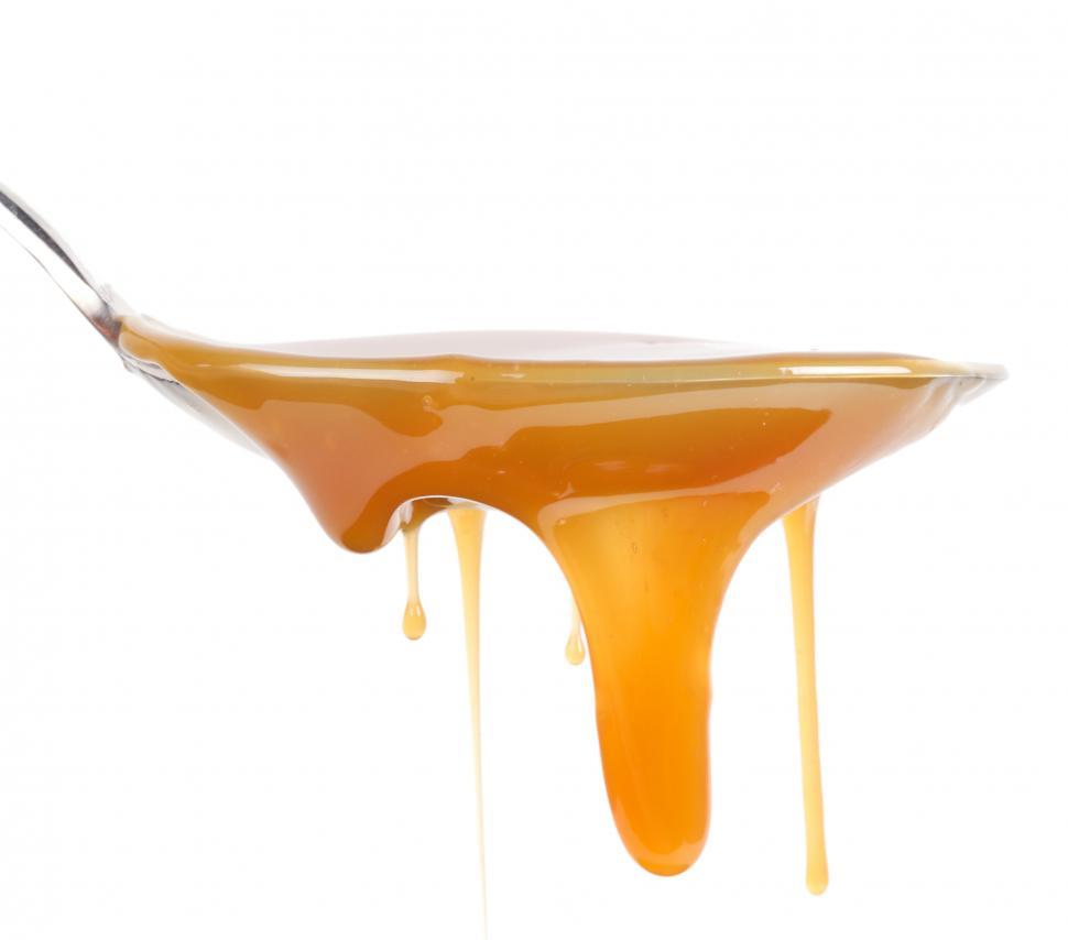 Free Image of Sweet caramel dripping from a spoon 