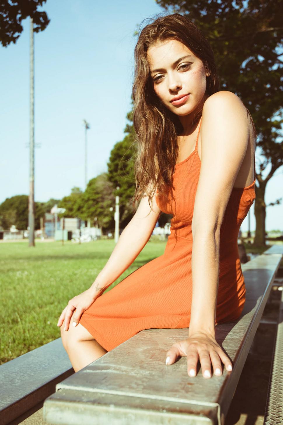 Free Image of Female fashion model posing in park - looking at camera 