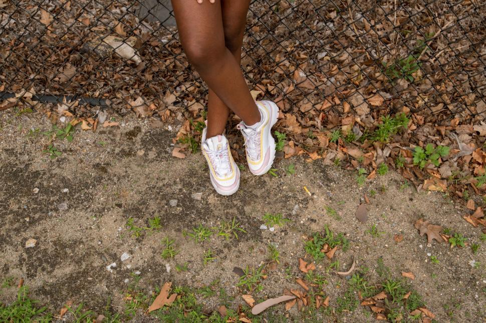 Free Image of Feet and white sneakers 