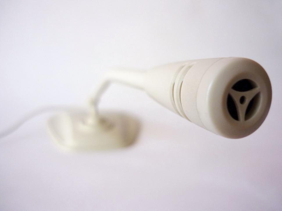 Free Image of Close Up of a Hair Dryer on White Surface 