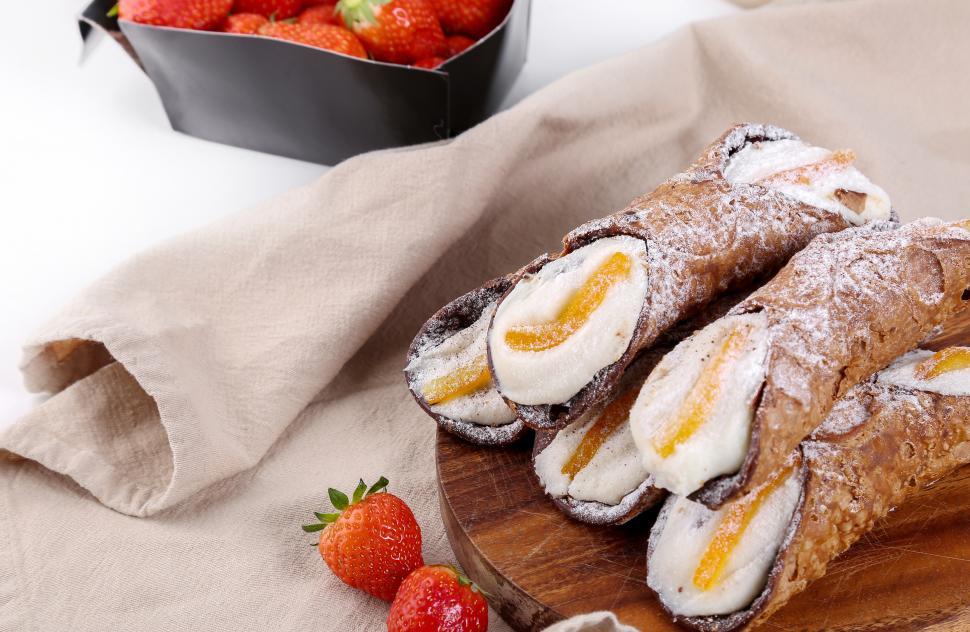 Free Image of Delicious cannolis, dusted with powdered sugar 