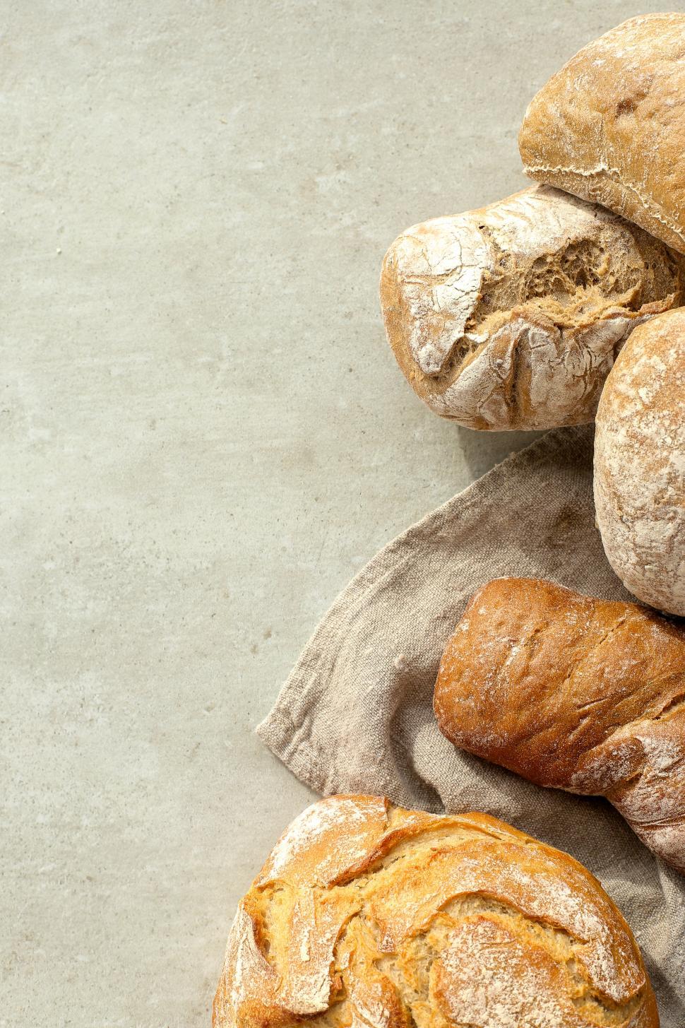 Free Image of Breads in a stack at the edge of a frame 
