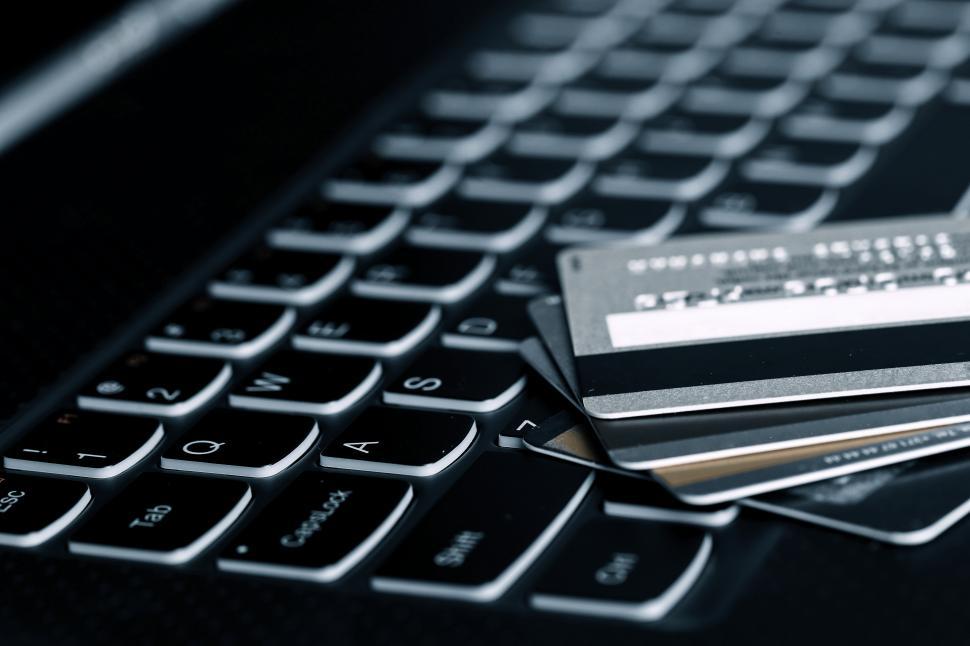 Free Image of Credit cards on a computer keyboard. Online finances. 