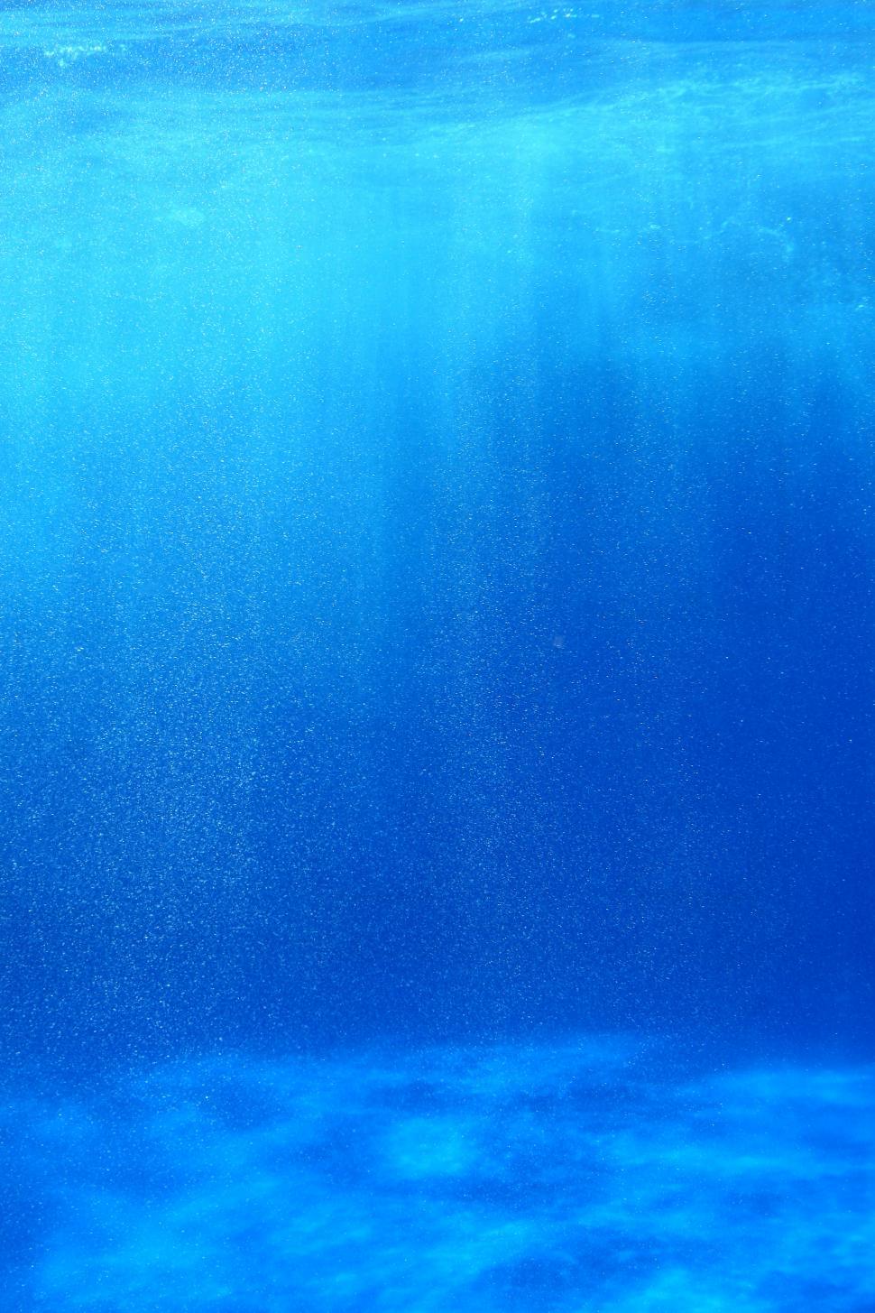Download Free Stock Photo of Penetrating light through the blue water 