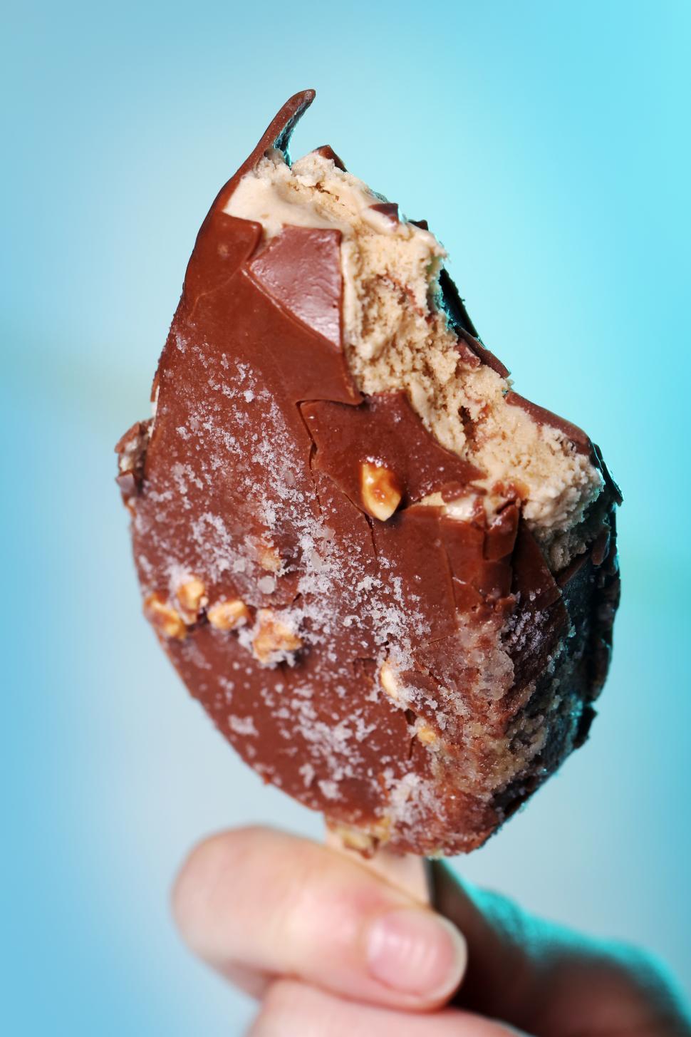 Free Image of Most of a chocolate ice cream dipped in chocolate  