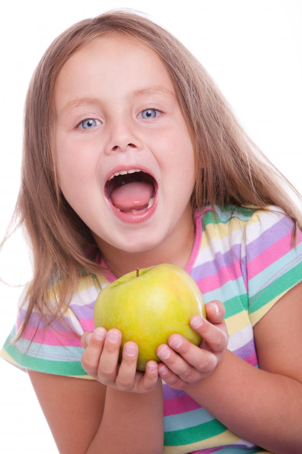 Free Image of Cute happy kid with green apple 