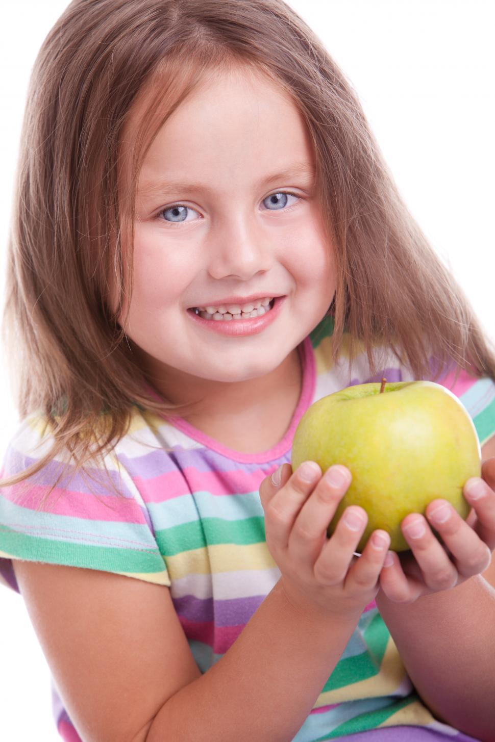 Free Image of Happy kid holding an apple 