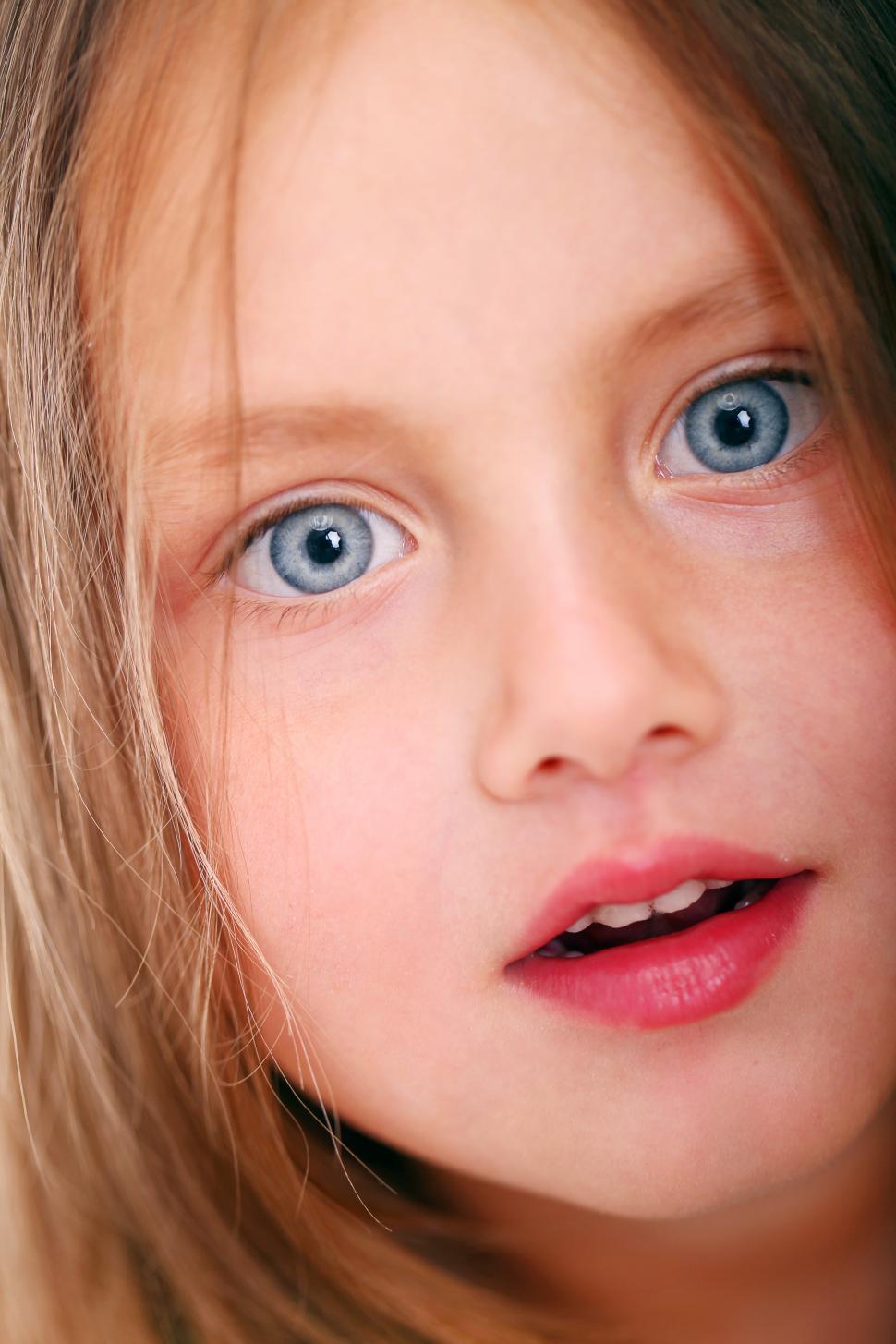 Free Image of Young girl with blue eyes, close up 