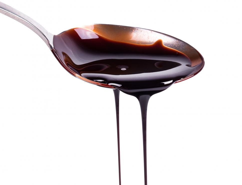 Free Image of Sweet melted chocolate dripping from a spoon 