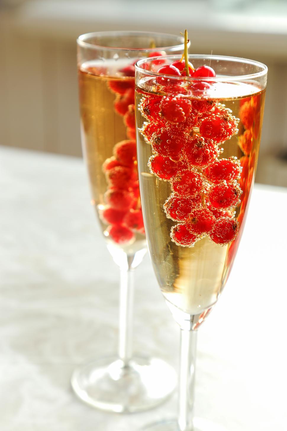 Free Image of Glasses of champagne with berries 
