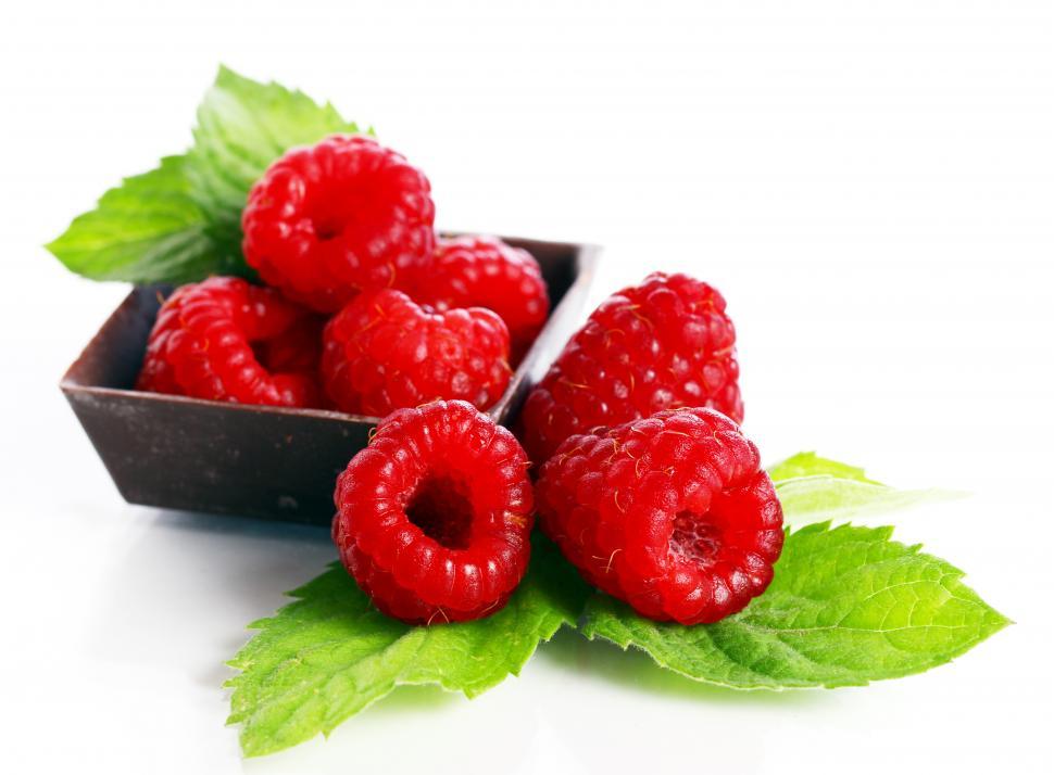 Free Image of Close up of cup of red raspberries 