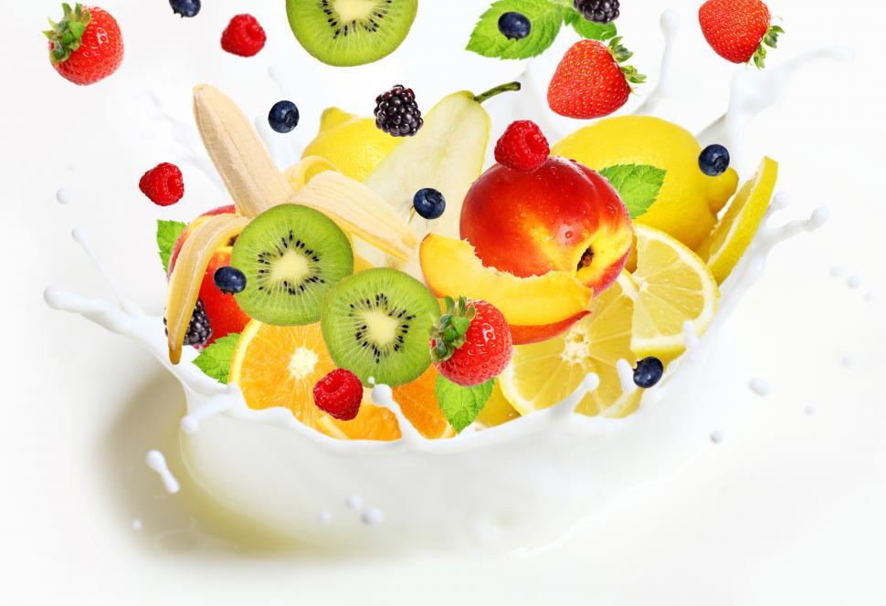 Free Image of Lot of different fruits falling into milk splash 