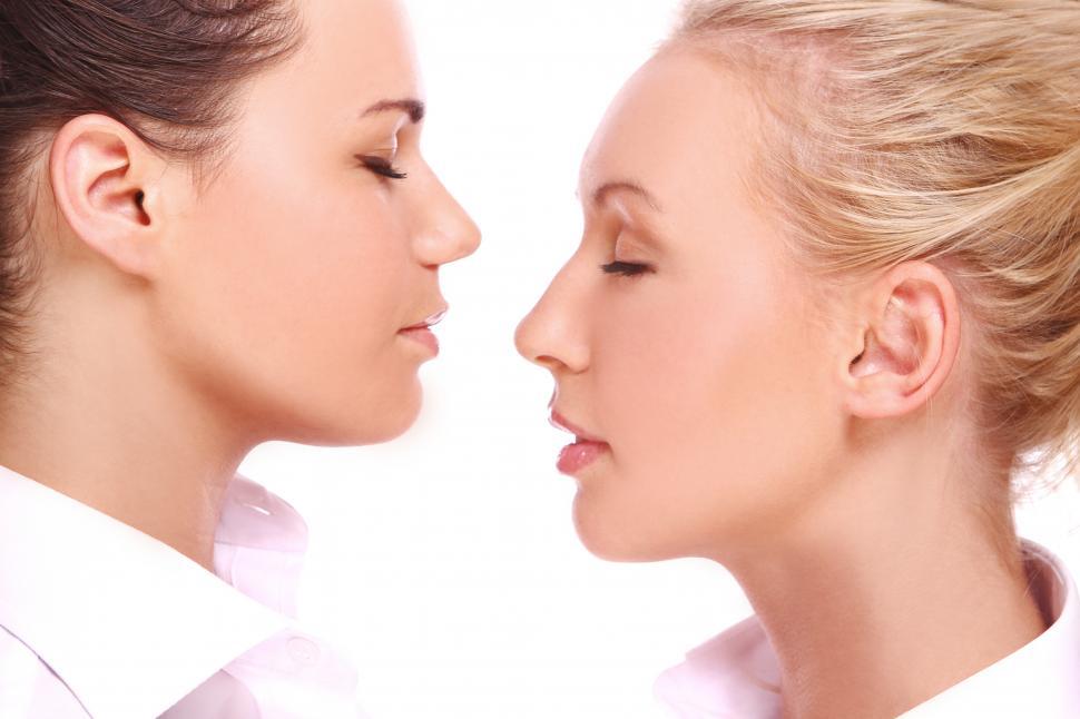 Free Image of Two girls in profile against white background 