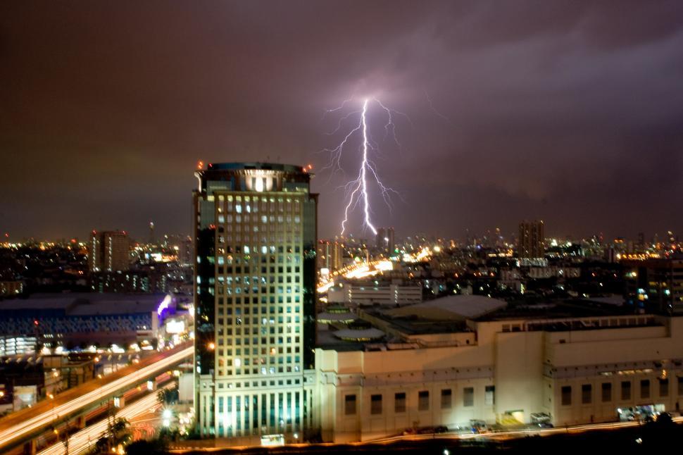 Free Image of Lightning Strikes Over a City at Night 