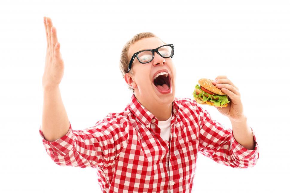 Free Image of Man in state of euphoria over hamburger 