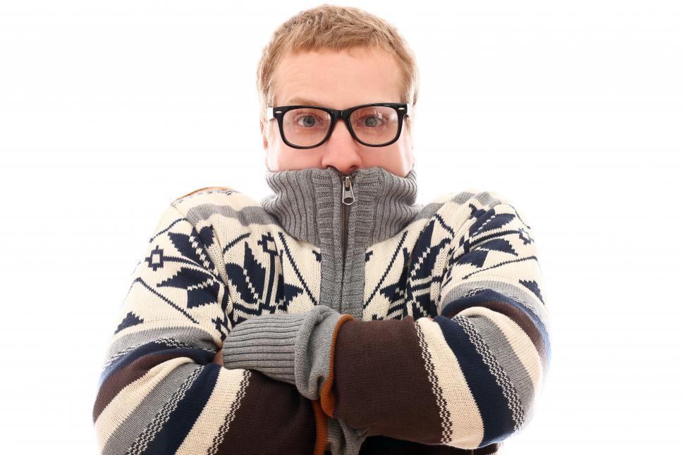 Free Image of Man with sweater zipped all the way up over his mouth 