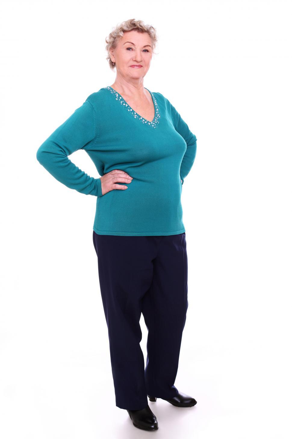 Download Free Stock Photo of Elderly woman standing, looking at the camera 