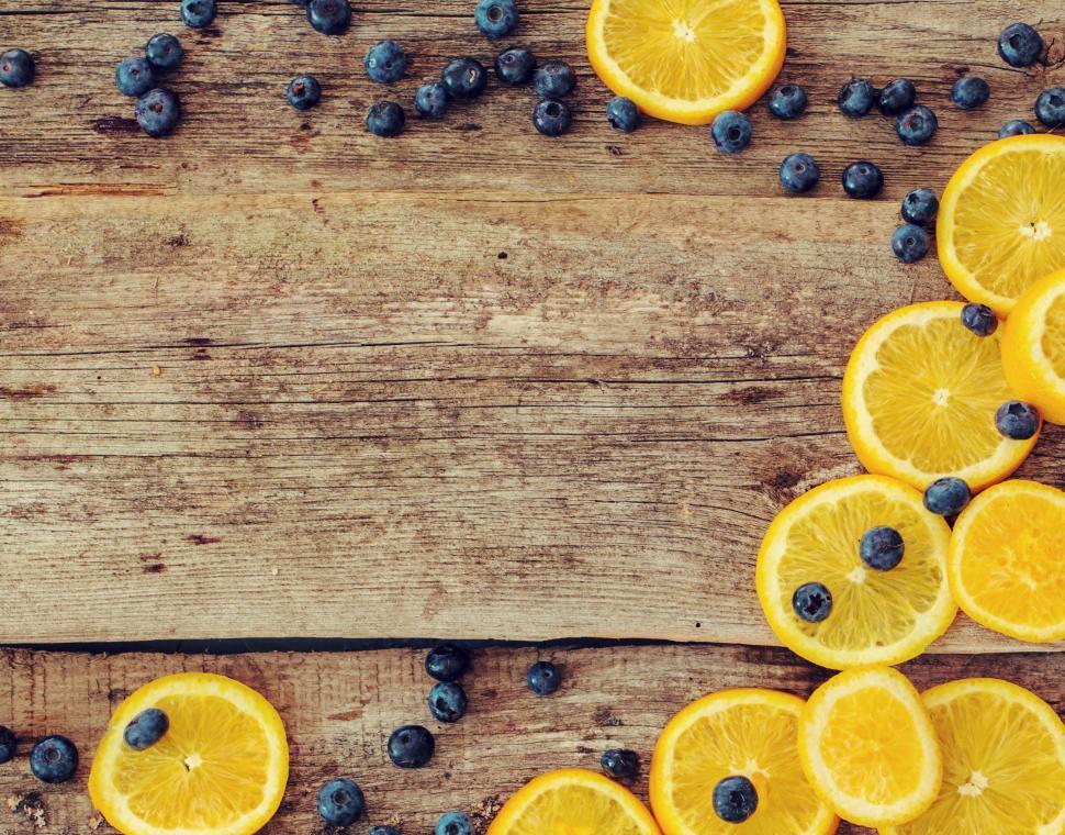 Free Image of Delicious oranges and blueberry background 