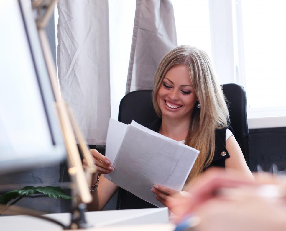 Free Image of Business people - woman reviewing documents 
