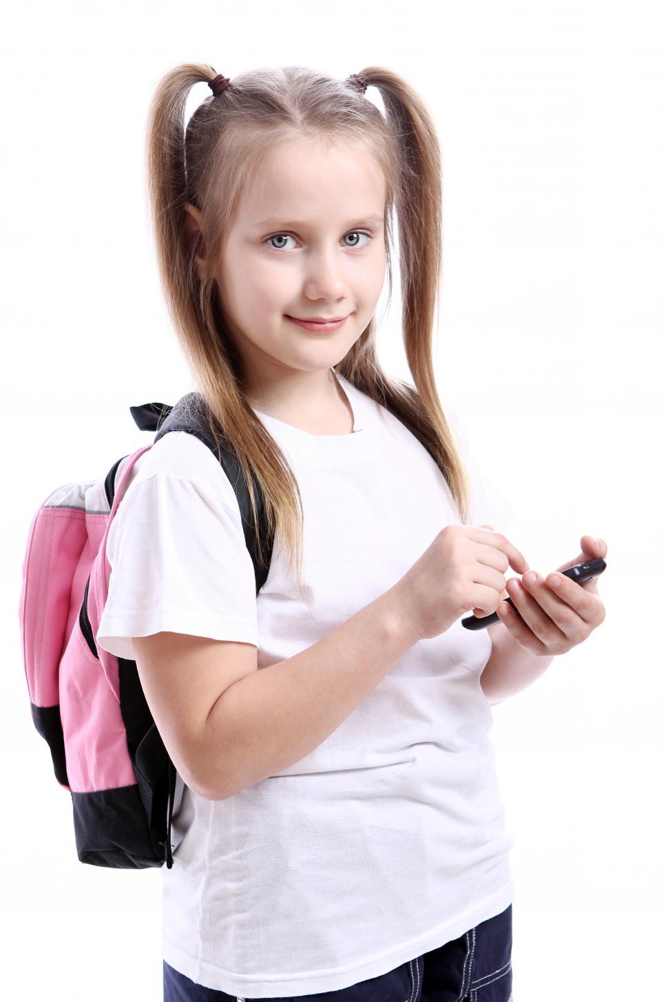 Free Image of Cute schoolgirl with cellphone 