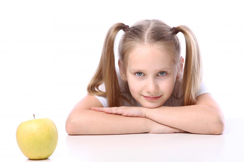 Free Image of School-age girl with fresh apple 