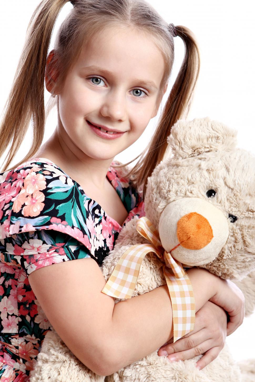 Free Image of Cute girl with her teddy bear 