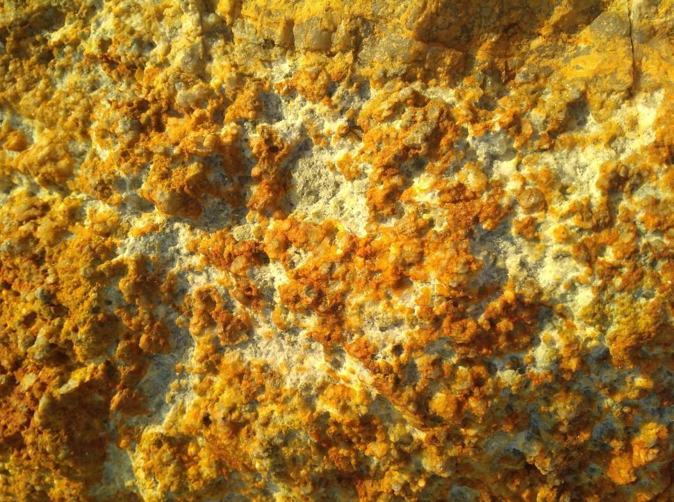 Free Image of Rusty orange colored rock texture  