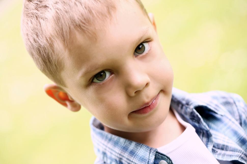 Free Image of Close up portrait of little boy in the park 