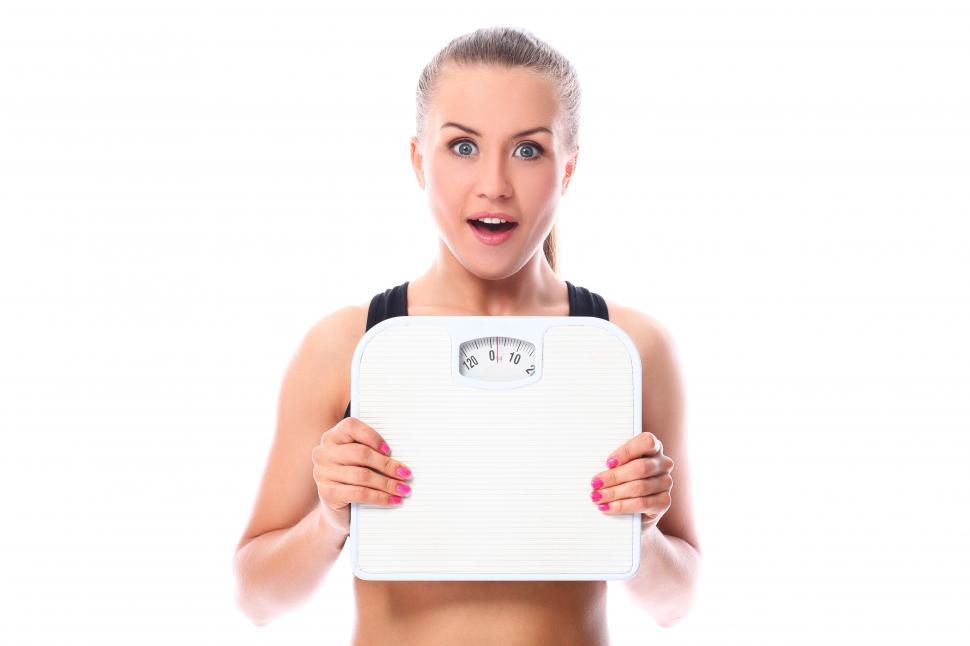 Free Image of Fitness girl holding a scale 