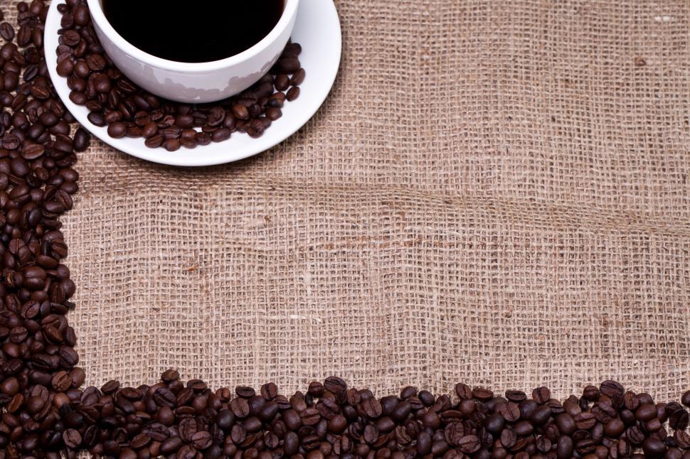 Free Image of Cup of hot coffee in burlap background, framing copyspace 