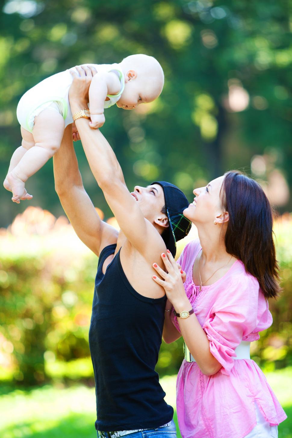 Free Image of Family with a baby relaxing in park at summer day  